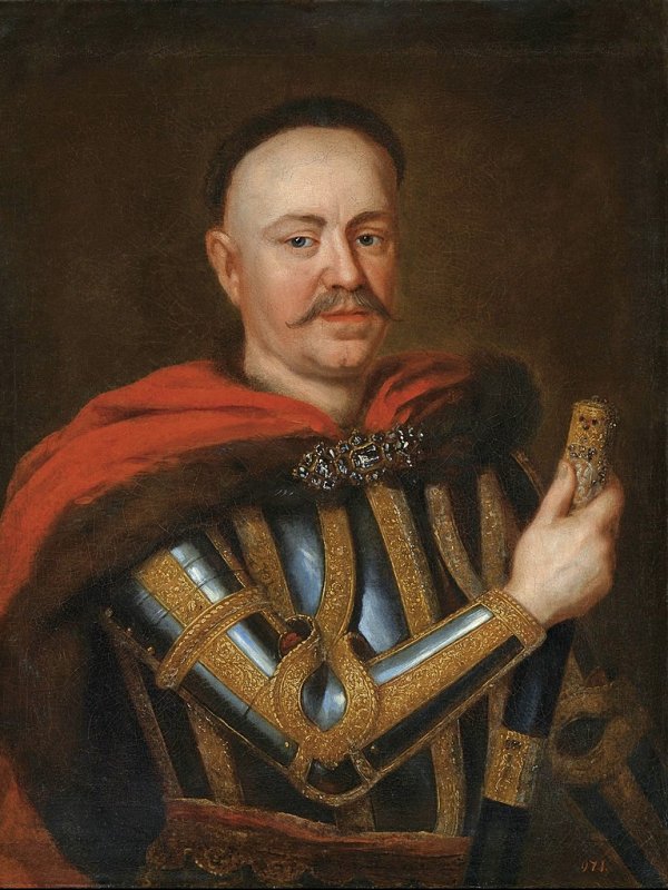 Szlachcic z wąsami, w zbroi i z buławą w ręku.