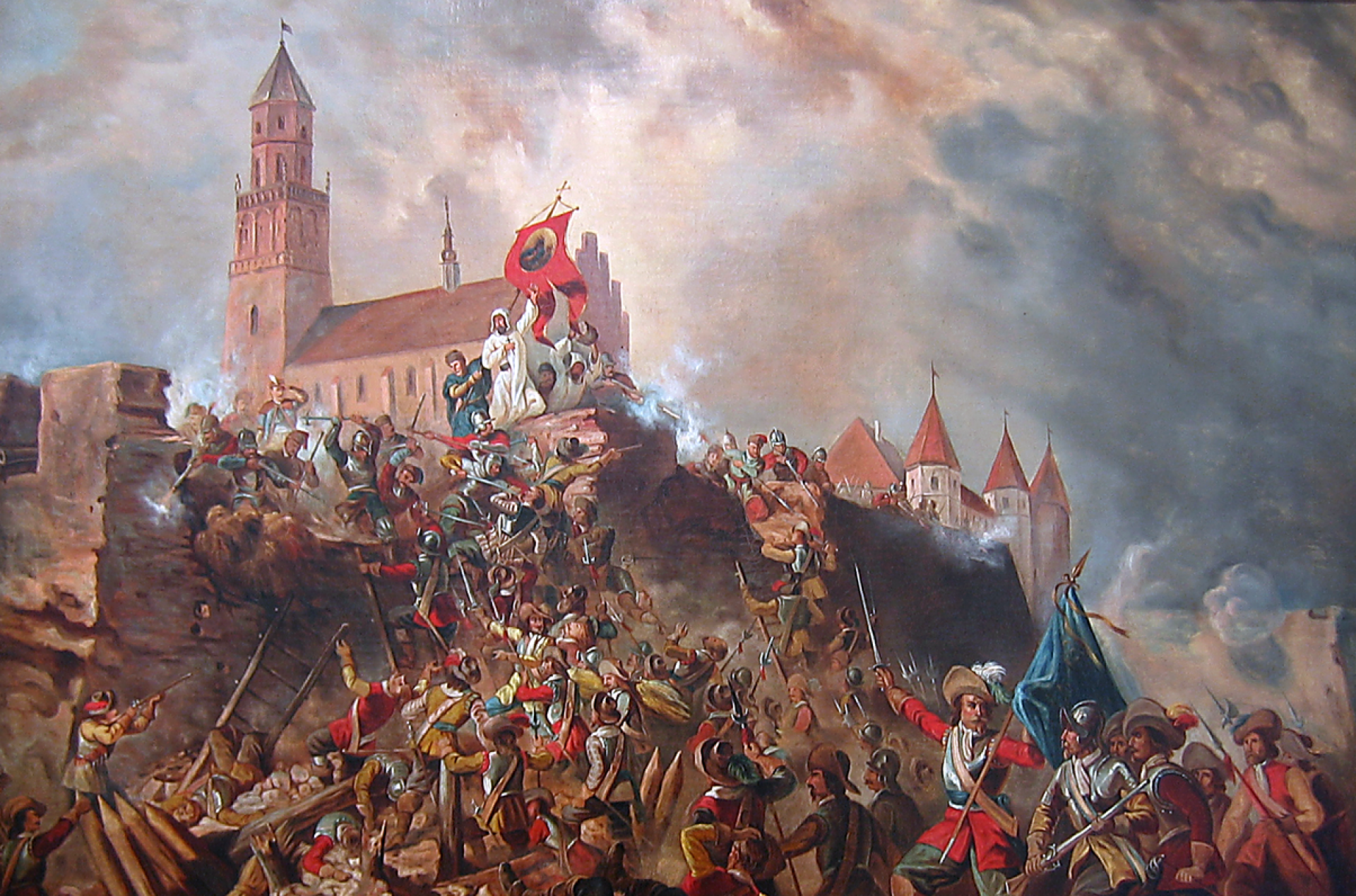 Wojsko szturmujące wzgórze z budynkiem klasztornym z wysoką wierzą.