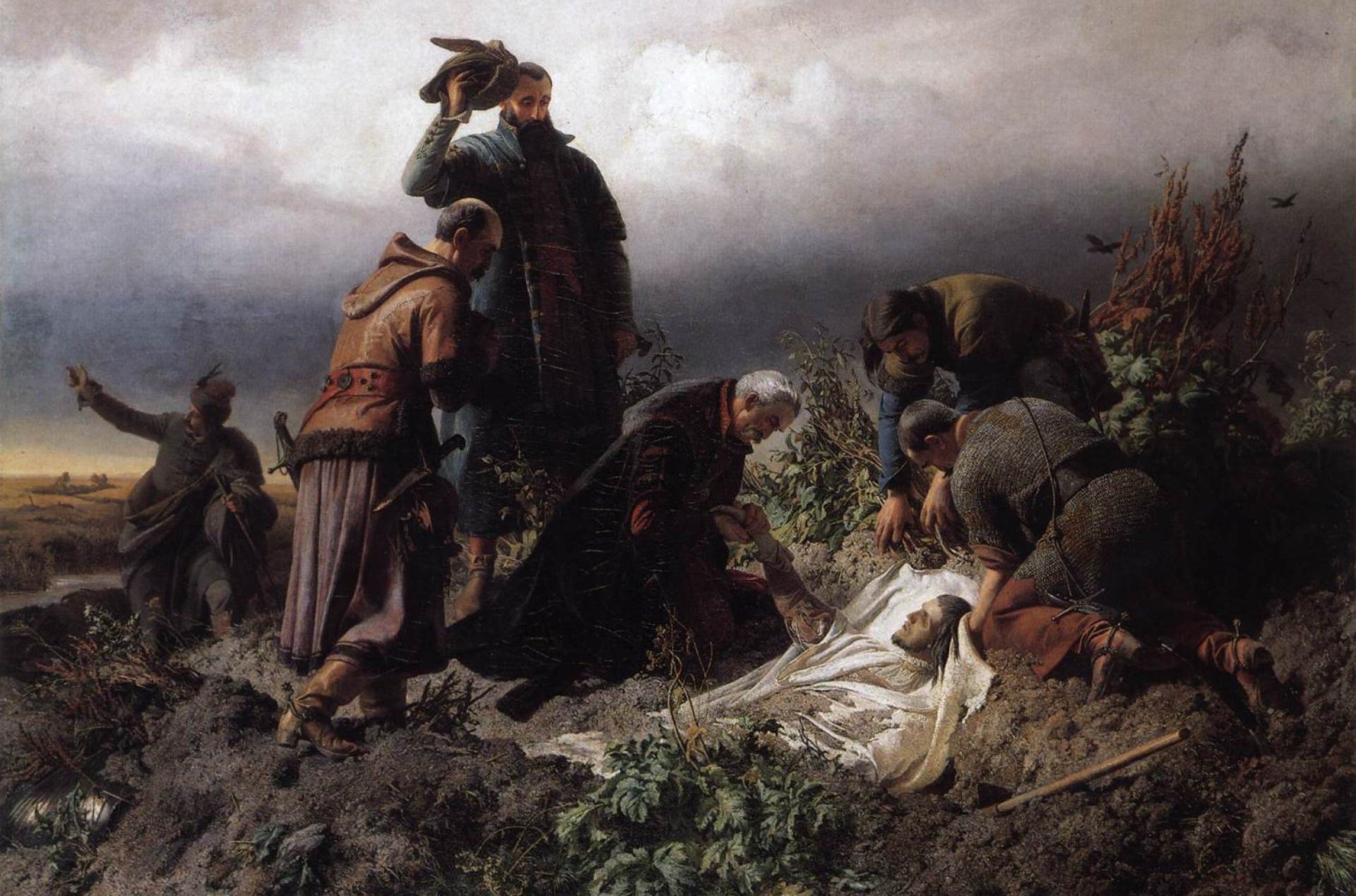 Grupa mężczyzn pochylających się nad ciałem młodego mężczyzny leżącym na białym prześcieradle. Błotnisty krajobraz, nisko wiszące szare chmury.