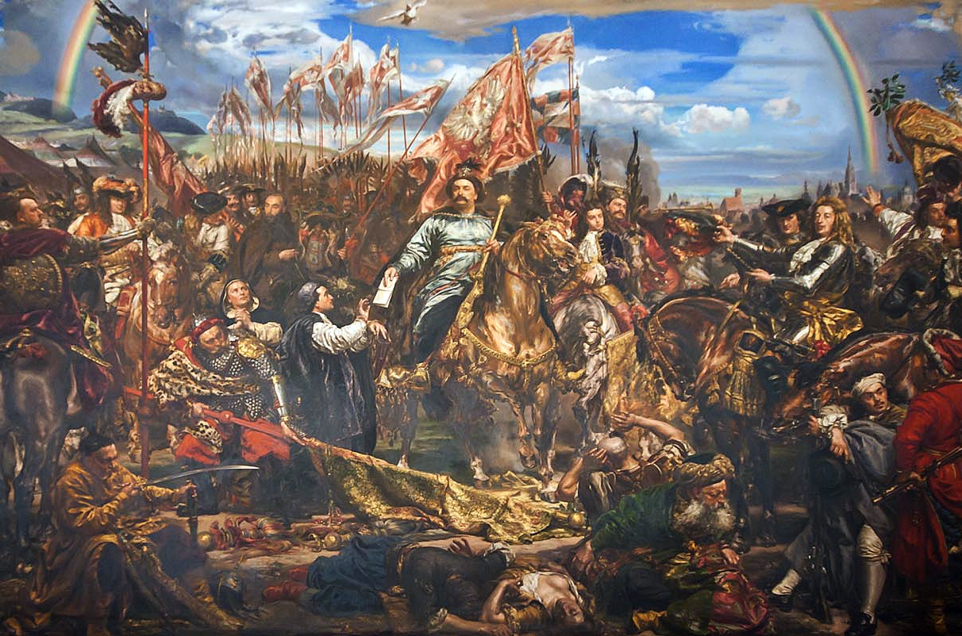 Scena przedstawiające wielu mężczyan na koniach, z licznymi chorągwiami, w centrum król Jan III Sobieski z buławą, na koniu