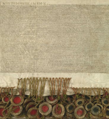 Pergamin z zapisem tekstu unii lubelskiej. Na dole kilkadziesiąt pieczęci woskowych przymocowanych na sznurkach.
